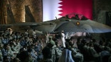 US and Qatari troops and staff await US President Donald Trump at the Al-Udeid air base southwest of Doha on May 15, 2025.
