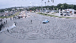 gif of cars doing donuts in intersection