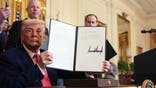 WASHINGTON, DC - APRIL 08: U.S. President Donald Trump holds up an executive order on American energy production after signing it during a ceremony in the East Room of the White House on April 08, 2025 in Washington, DC. The Trump administration has elected to roll back Biden-era environmental policies with the intention to help revive coal-fired plants in order to restore America’s energy independence. (Photo by Anna Moneymaker/Getty Images)