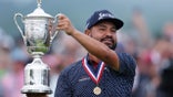 J.J. Spaun holds up U.S. Open trophy