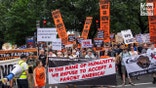 Anti-Trump protesters march in DC