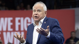 gov tim walz confused and giving a shrug