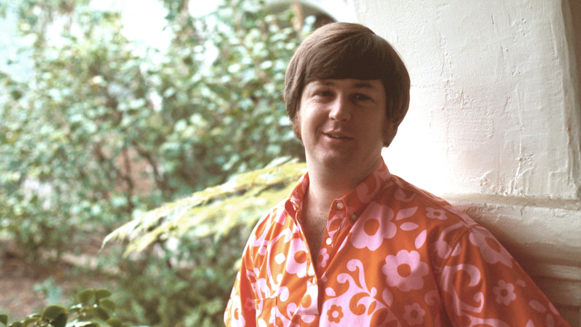 Brian Wilson of the Beach Boys wears a red shirt