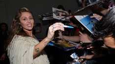 Miley Cyrus responds to frustrated hecklers with surprise performance at Tribeca Festival