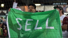 Athletics fan confronted by security for wearing 'SELL' t-shirt caught on live broadcast