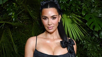 Kim Kardashian shares intimate bikini photos from inside her glass-encased wardrobe