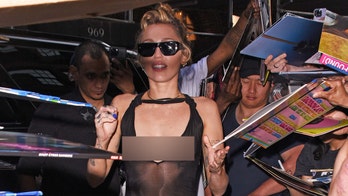 Miley Cyrus stuns fans in daring dress during New York album signing