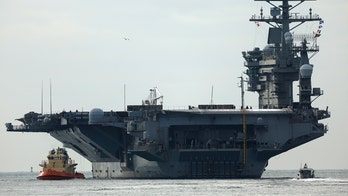 USS Nimitz carrier strike group sailing toward Middle East ahead of schedule, US official says
