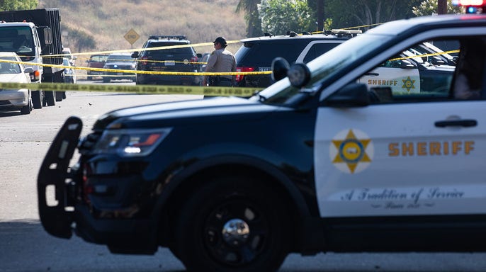 A Los Angeles County sheriff's vehicle at a crime scene