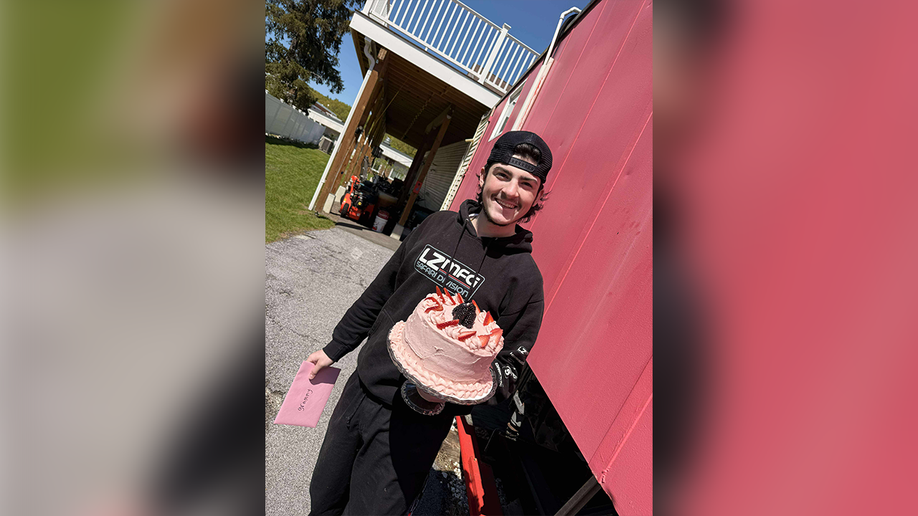 Aiden Sloan with cake