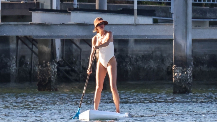 Gisele Bundchen on paddle-board