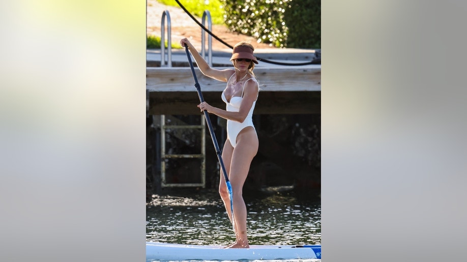 Gisele Bundchen paddle-boarding