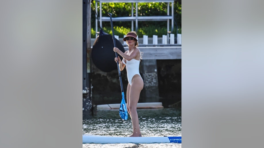 Gisele Bundchen paddle-boarding