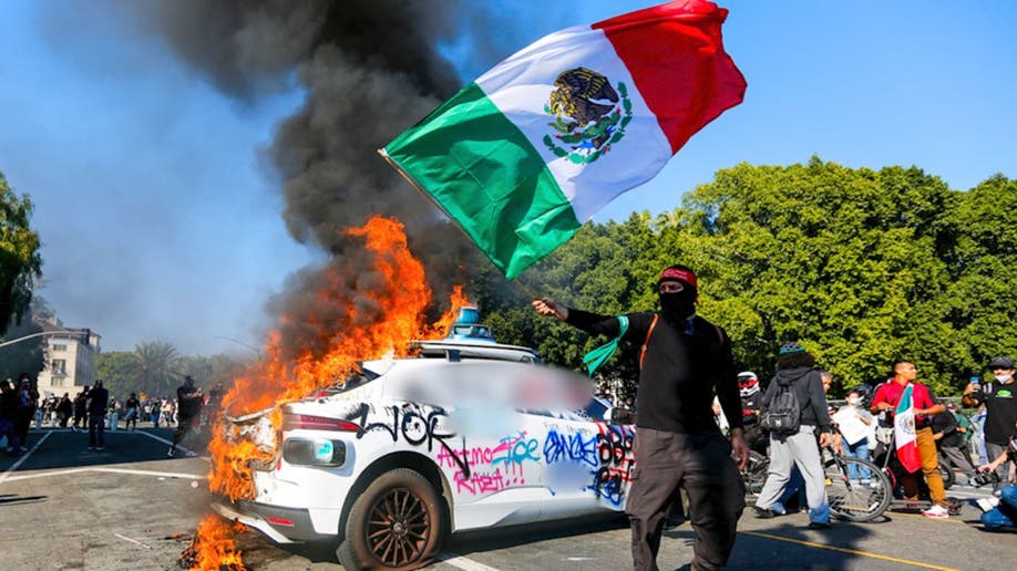 Protester waving Mexican flag