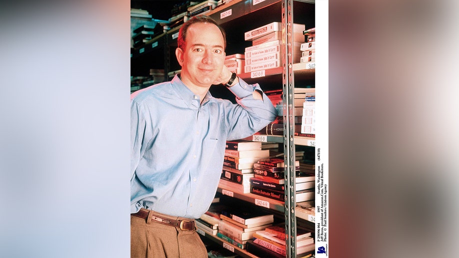 Jeff Bezos next to a bookshelf in 1997.