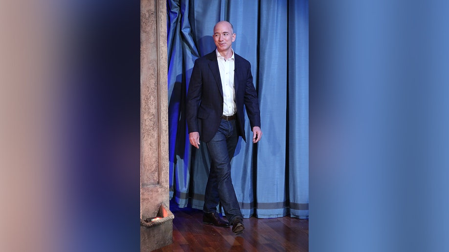 Jeff Bezos walking on stage at "The Tonight Show starring Jimmy Fallon."