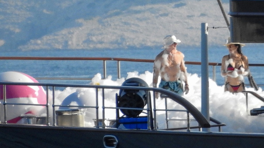 Jeff Bezos standing by himself in the middle of a bunch of foam.