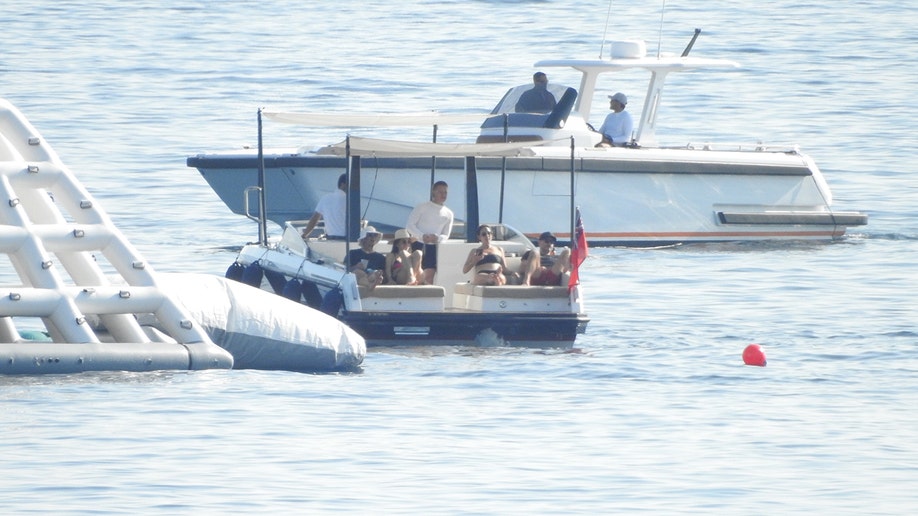 Another couple joined Bezos and Sanchez on the speedboat, where they relaxed on daybeds.