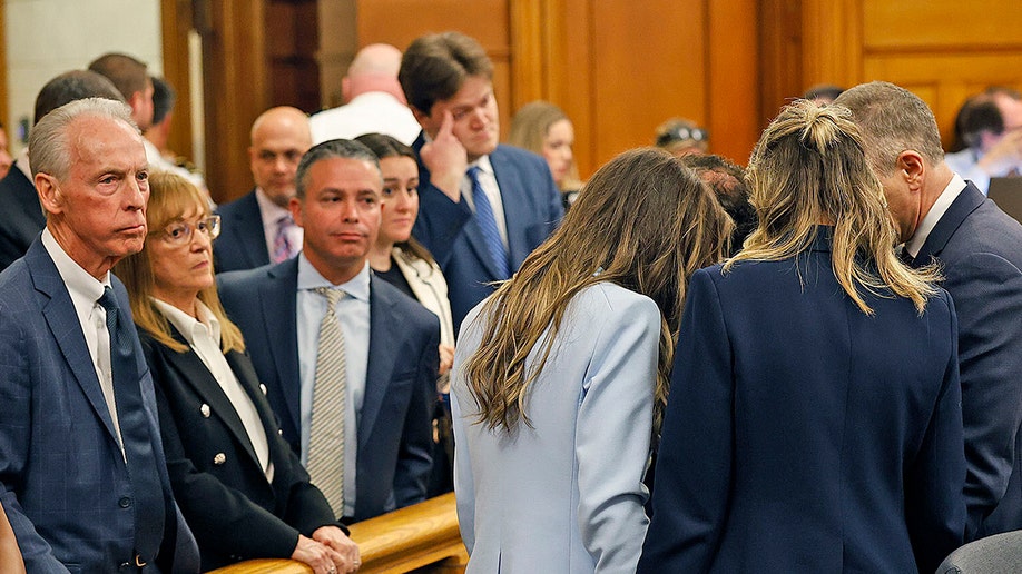 Karen Read in court praying before hearing the verdict.