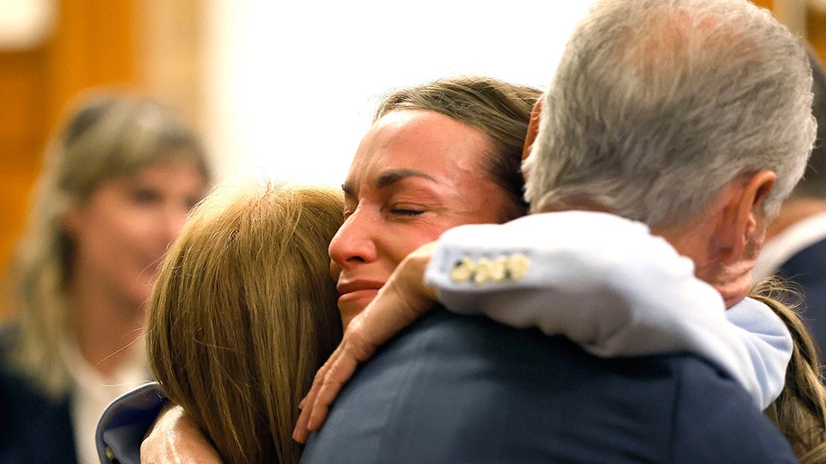 Karen Read embraces her parents in court after hearing the verdict.
