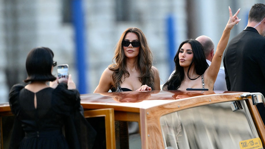 Kim and Khloe Kardashian on a boat.