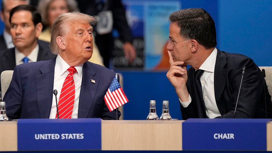 President Donald Trump, left, speaks to NATO General Secretary Mark Rutte during a North Atlantic Council plenary meeting.