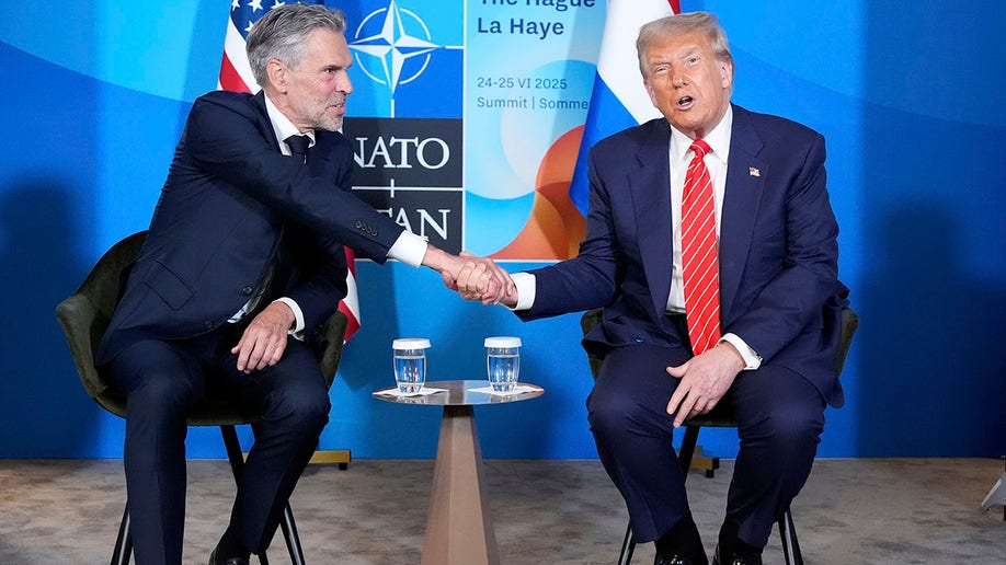 President Donald Trump and Netherlands' Prime Minister Dick Schoof shake hands at a NATO summit at the Hague.