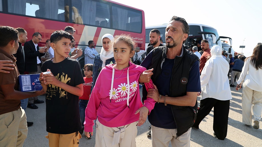 A Palestinian family awaits evacuation from the Gaza Strip via the Jordan Medical Corridor.