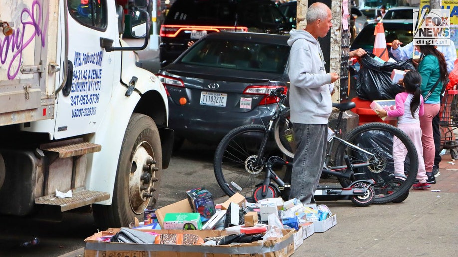 A man trading various items successful Roosevelt Avenue successful Queens, New York City.