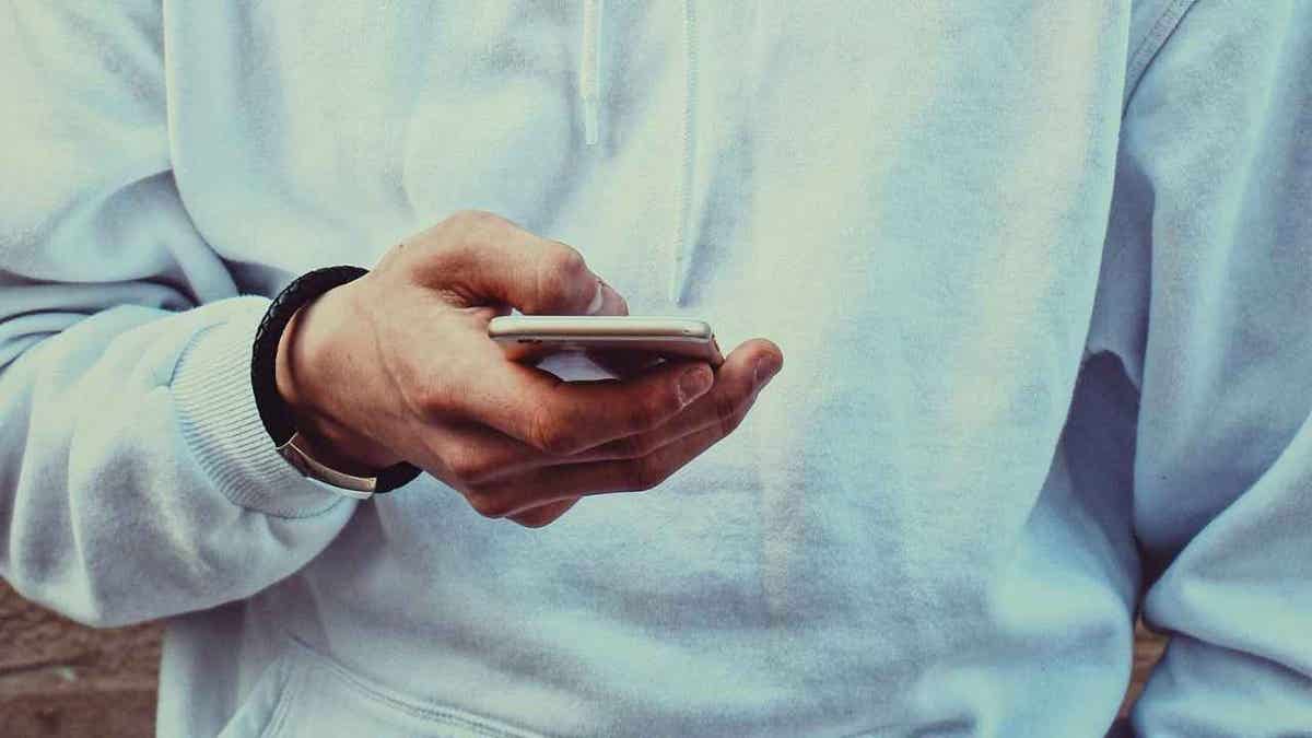 man pinch phone