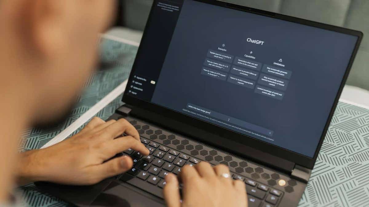 A man using ChatGPT on his laptop.