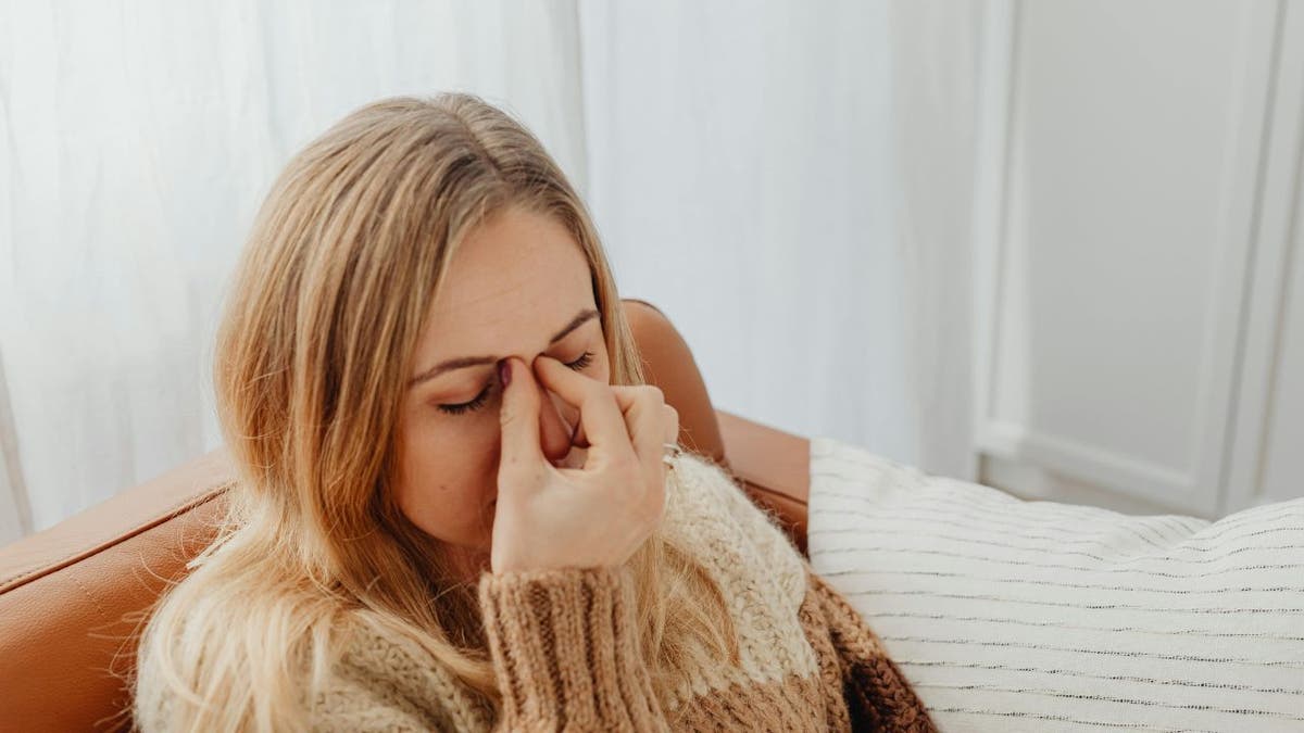 A woman with a sinus infection.