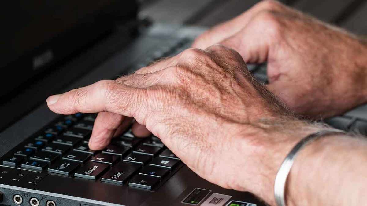 A man typing on a keyboard.