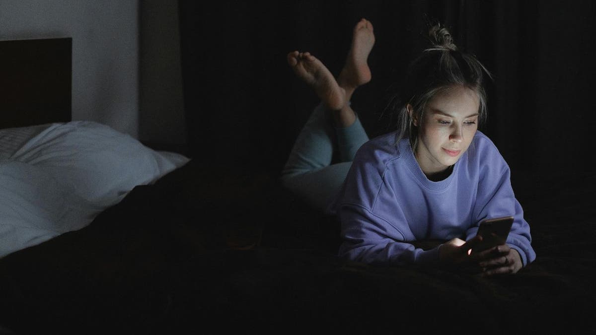 woman scrolling phone