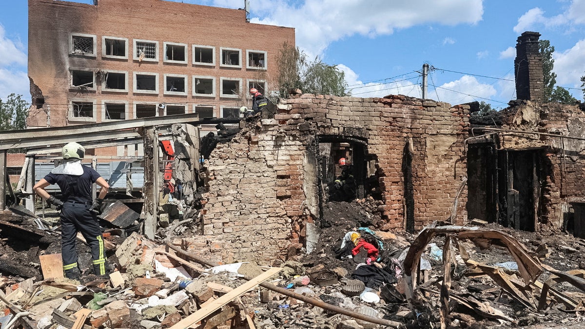 Firefighters work at the site of buildings hit by Russian drone strike, amid Russia's attack on Ukraine, in Poltava, Ukraine July 3, 2025.