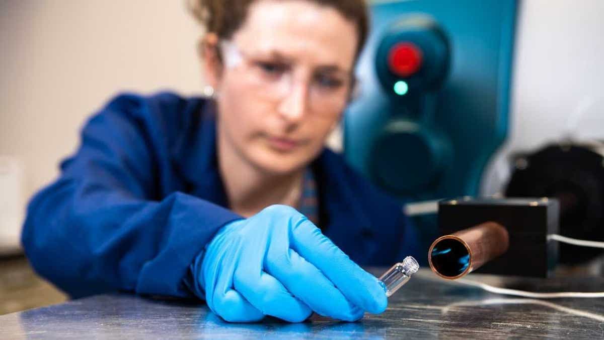 Chemist Elizabeth Denis uses the PNNL system to check a substance in the laboratory.