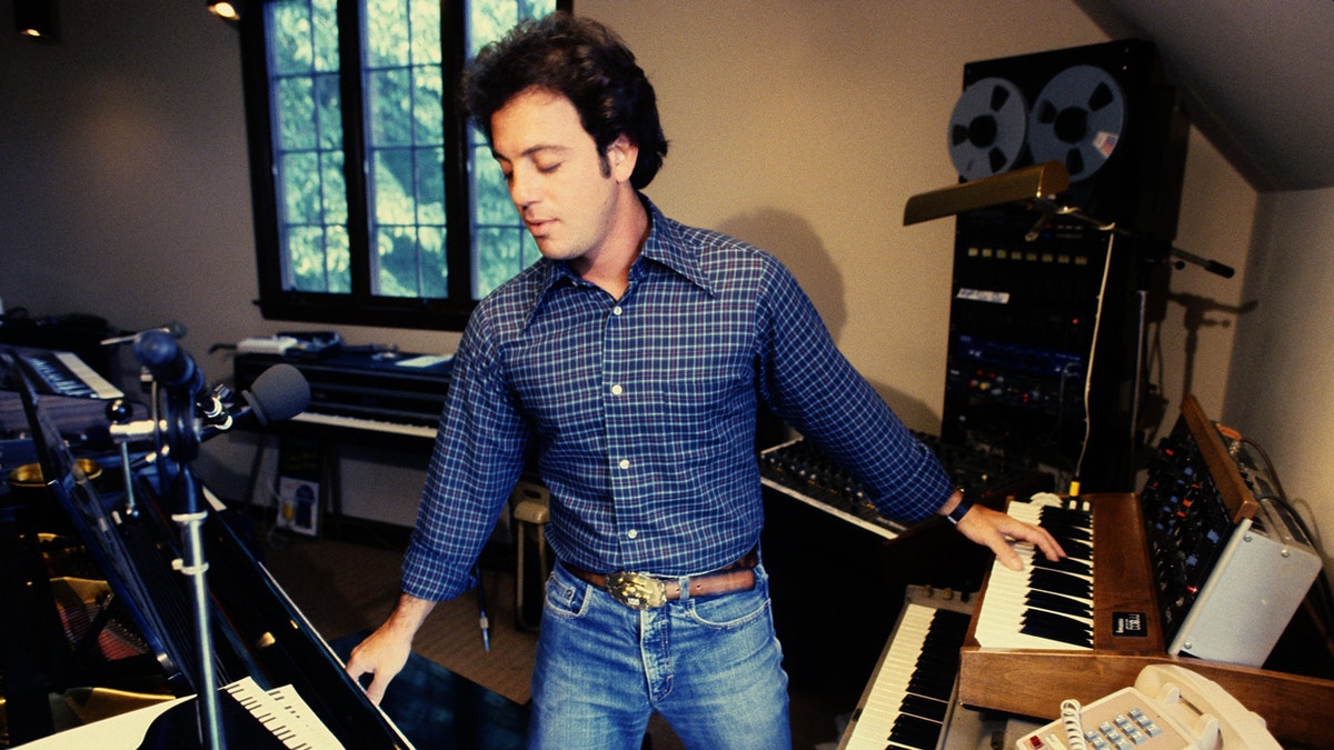 Billy Joel plays the piano at home in LA