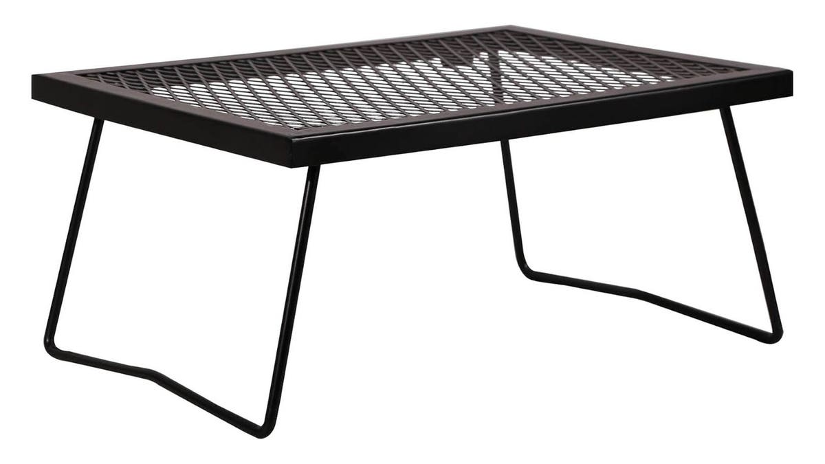 Cook over the fire easily with this grill.