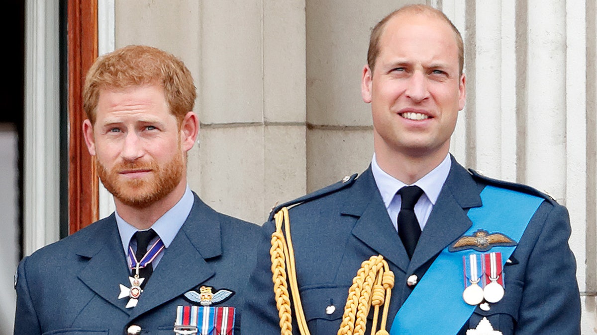 Prince Harry and Prince William in uniform outside Buckingham Palace