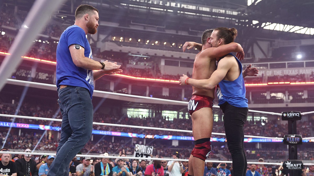 Adam Cole embraces Roderick Strong and Kyle O'Reilly