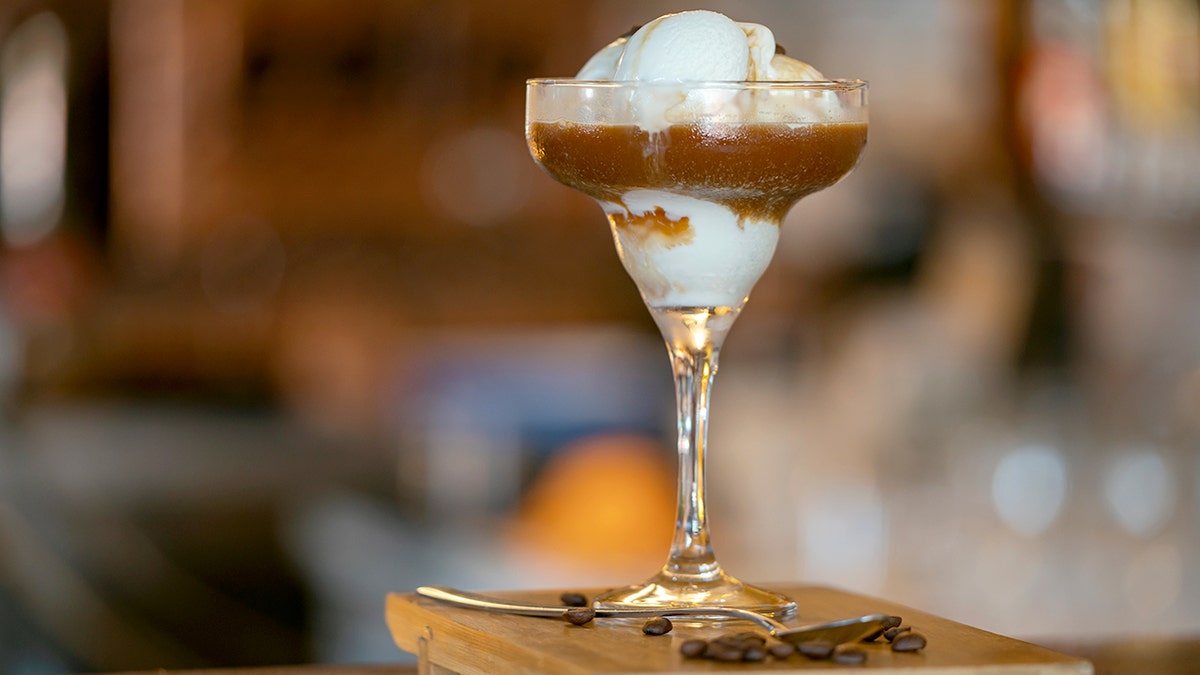 Affogato coffee with ice cream in a martini glass.