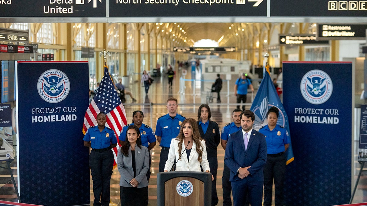Homeland Security Secretary Kristi Noem speaks during a news conference where she announced that most airline passengers will no longer have to remove their shoes at security checkpoints on Tuesday, July 8, 2025, at Reagan National Airport in Washington. (AP Photo/Mark Schiefelbein)