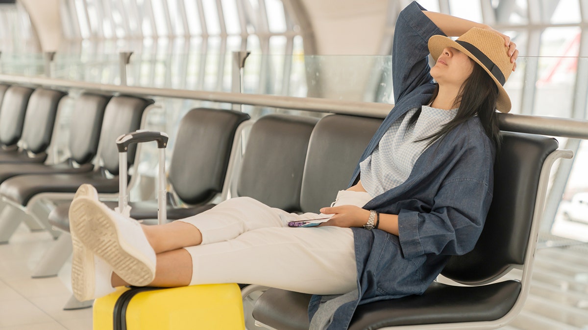 Flying passengers sleeping at the airport