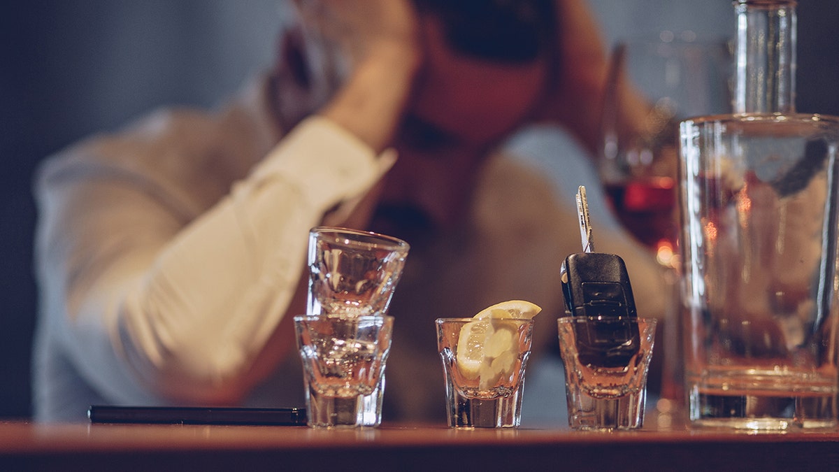 Man suffering hangover at bar