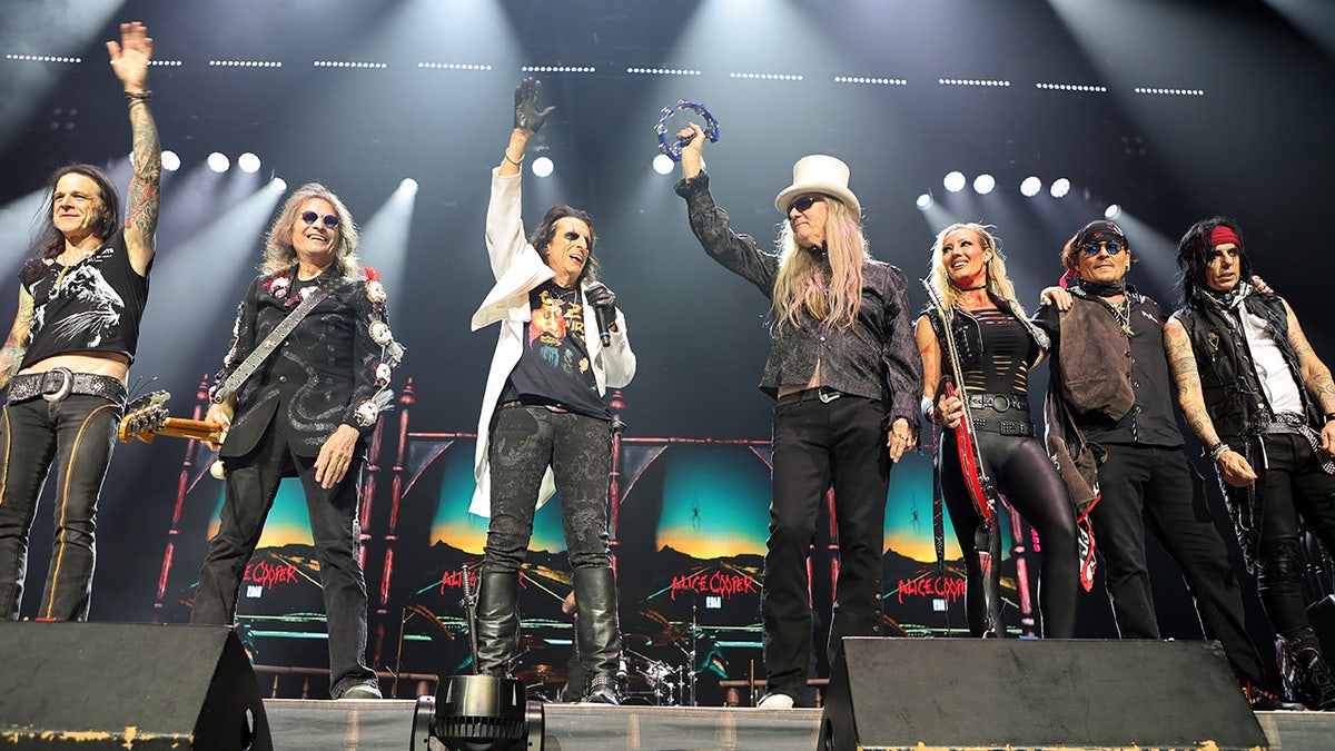Johnny Depp taking bow with Alice Cooper's band