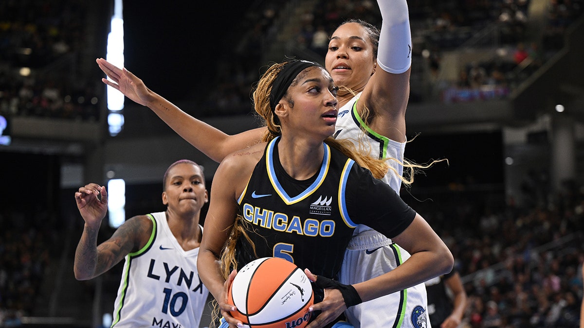 Angel Reese drives to the basket