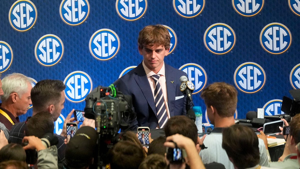 Arch Manning looks on at SEC Media Day