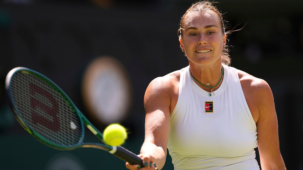 Aryna Sabalenka returns the ball
