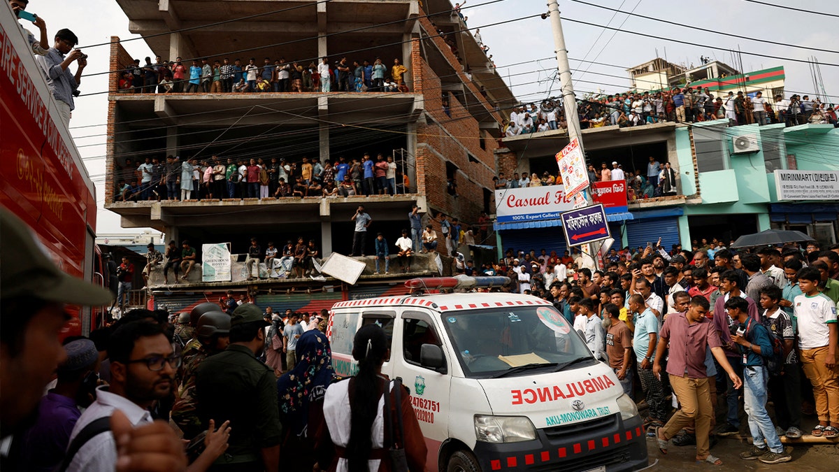ambulance passes a building