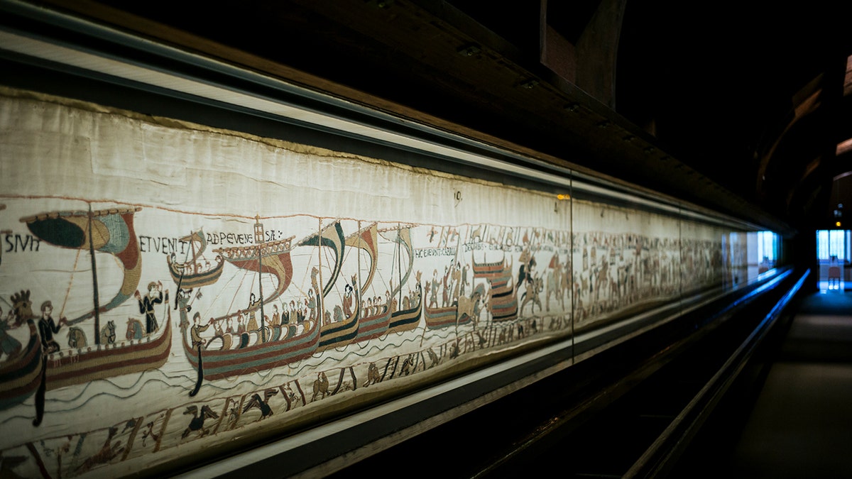 Image of Bayeux Tapestry in museum